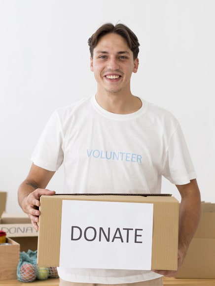 happy volunteer holding donate